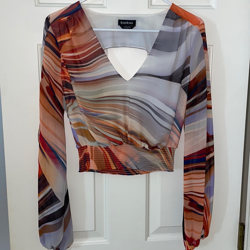 Multicolored Bebe shirt with back out arm slits